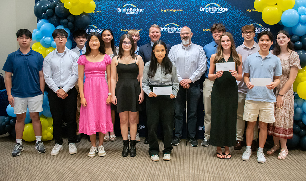 The 2025 BrightBridge Credit Union scholarship winners pose for a photo with BrightBridge President & CEO John J. Howard and Brad Goodman (both center) during the credit union’s annual awards ceremony. 