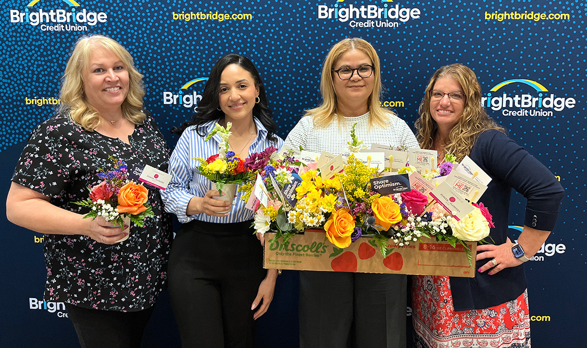 BrightBridge's HR department smiles with the bouquets created in the Lawrence corporate office. From left: Colleen Vivier, Elizabeth Diaz, Elisanta Torres and Tracy Mermet.